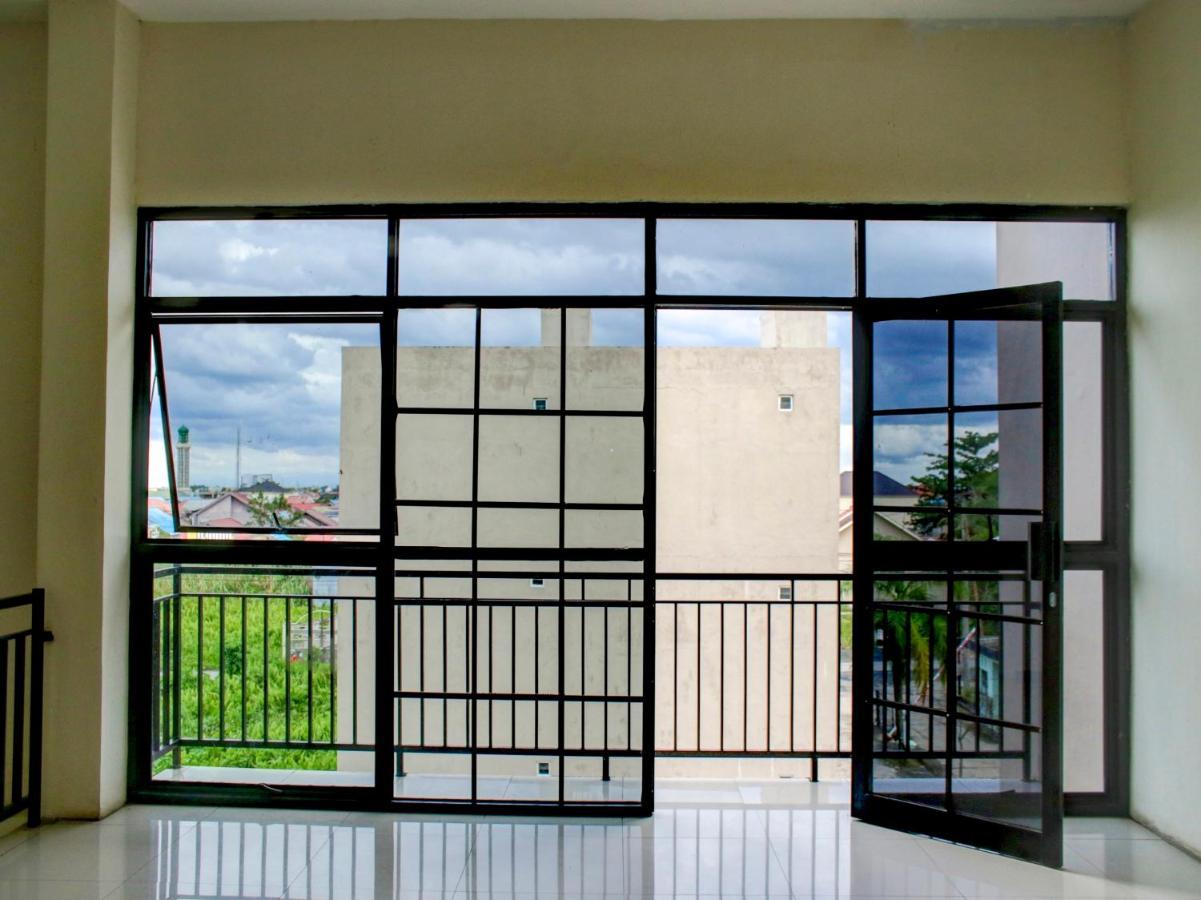 Oyo 90162 Remboelan Guest House Sungai Lutus Exterior foto